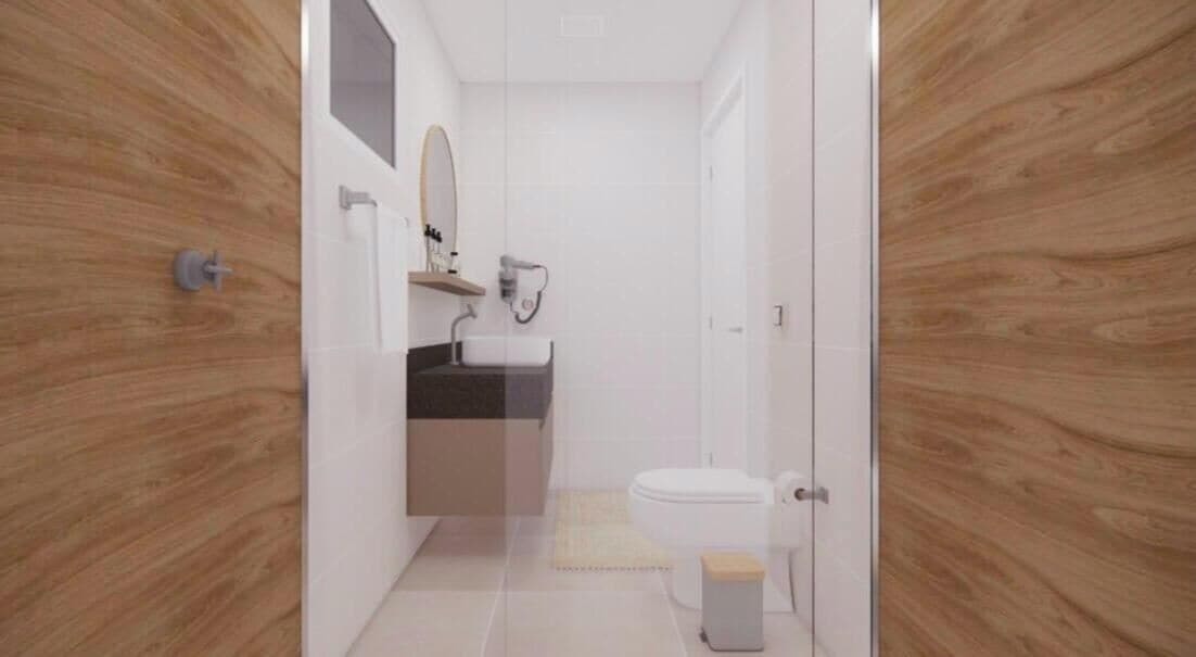 A modern bathroom with a wooden wall, a white sink, a mirror, and a toilet.