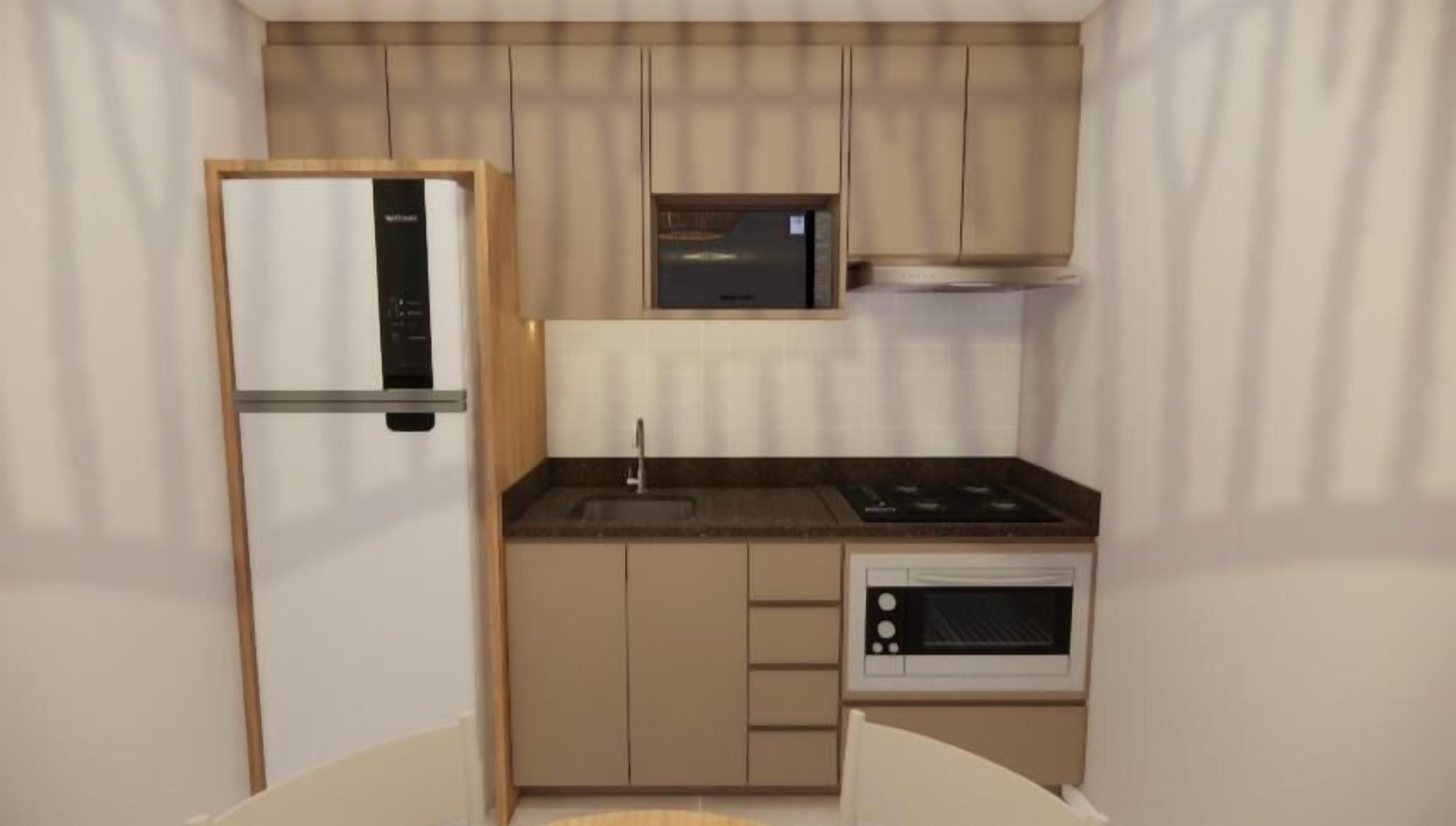 Een kleine keuken met een koelkast, magnetron, kookplaat en oven.