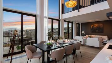 Luxury Duplex, Ocean View | Living area | Flat-screen TV