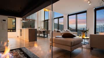 Luxury Duplex, Ocean View | Living area | Flat-screen TV