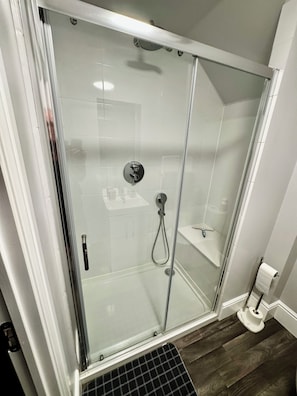 Shower, hair dryer, towels, toilet paper