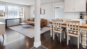 A modern apartment with a living room, dining area, and kitchen. - Family Retreat - 1 Mile to The Factory at Franklin (Franklin)