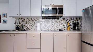 Fridge, microwave, stovetop, coffee/tea maker