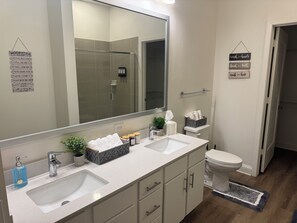 Shower, hair dryer, towels, soap
