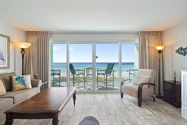 This bright living space in Destin opens directly to a private balcony overlooking the Emerald Coast's sugar-white sands and turquoise waters.