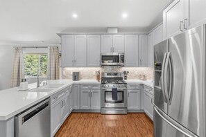 Coffee/tea maker, fridge, microwave, oven