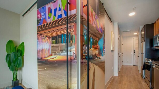 A modern kitchen with wooden cabinets, a built-in oven, and a microwave. - Deep Ellum | 4 Ppl | Walkable | Great Views (Dallas)
