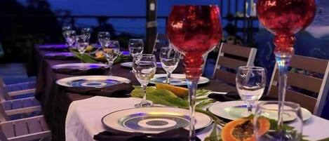 A table set for dining with plates, cutlery, and glasses.