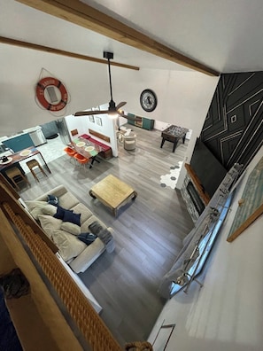 Smart TV, fireplace, table football, books
