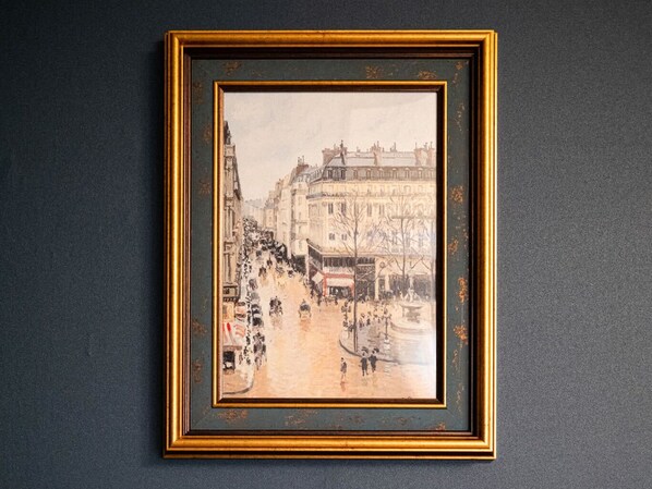 A framed black and white painting of a street scene with buildings and people. - KANSEI null SAGA (Saga)