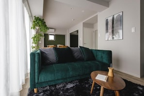 Comfort Quadruple Room, Balcony | Living area