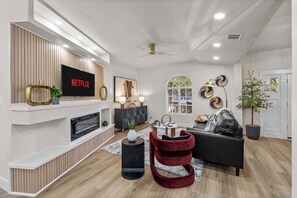 Smart TV, fireplace, books