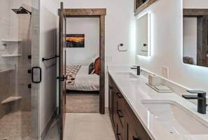 Shower, hair dryer, towels, shampoo