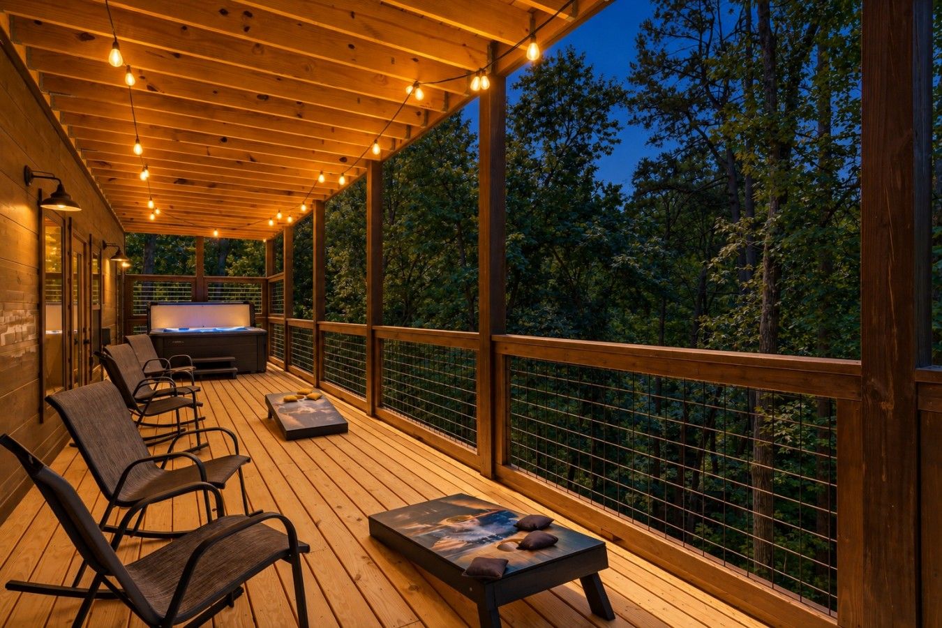 A wooden deck with seating, a hot tub, and a view of trees.