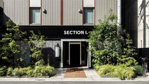 A modern building facade with a sign reading "SECTION L". - Section L Ueno-Hirokoji (Tokyo)