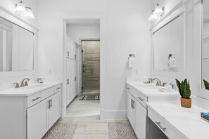 A modern bathroom with two sinks, a shower, and a walk-in shower. - Sleeps 20 | 2 Homes, 9BDR, Arcade | Walk to Blue Mountain Beach Access & Eats (Santa Rosa Beach)