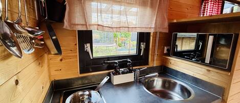 Fridge, microwave, stovetop, coffee/tea maker