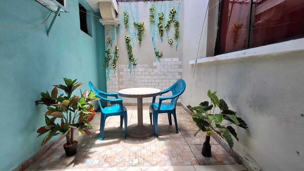 Classic Triple Room, Non Smoking, Courtyard View | Terrace/patio