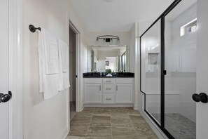 A modern bathroom with a glass shower enclosure, white cabinetry, and a large mirror above the sink. - 1 King 2 Queens Garage Yard Washer Dryer (Old Hickory)