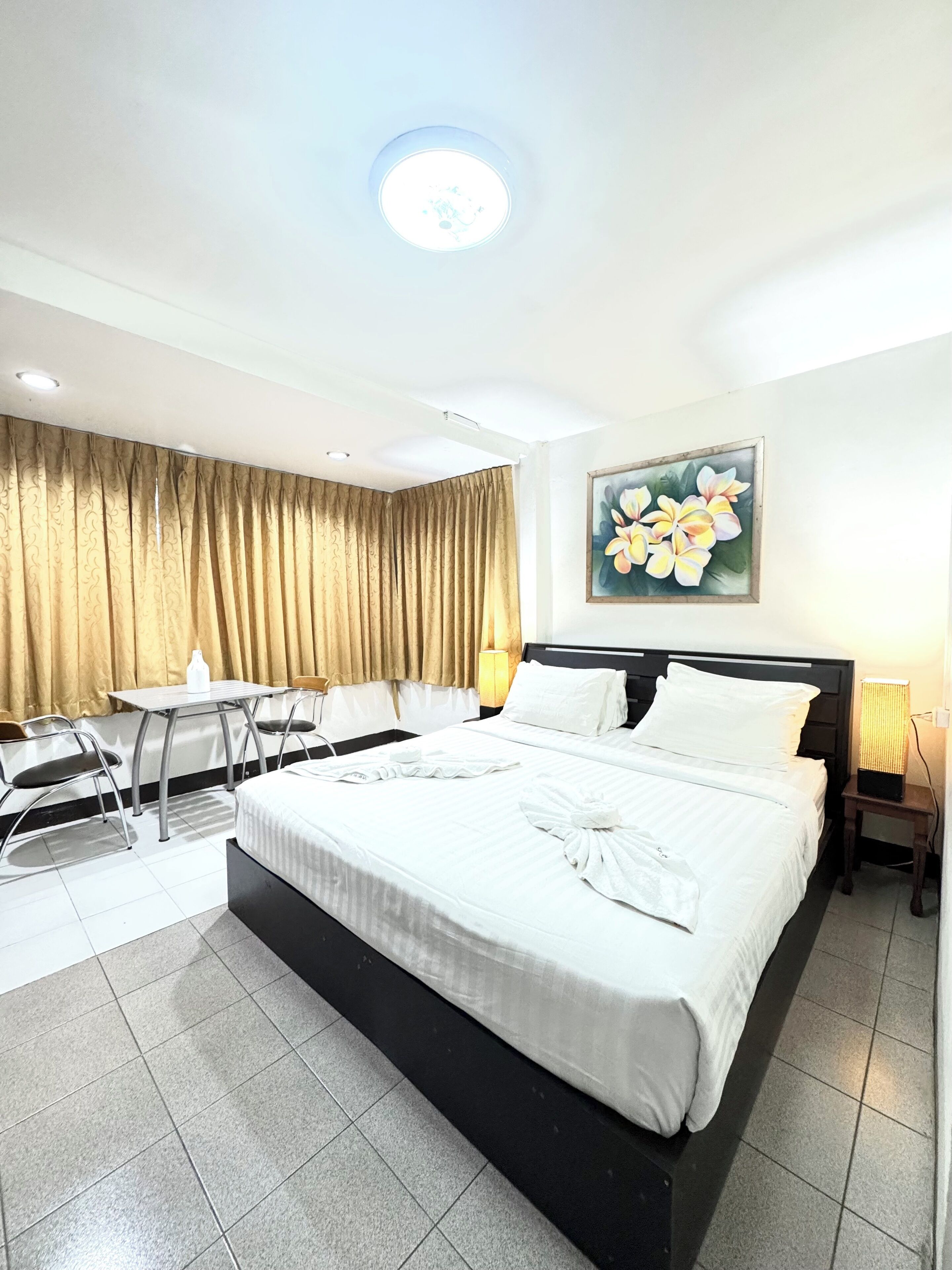Room, 1 King Bed | Minibar, in-room safe, iron/ironing board, free WiFi