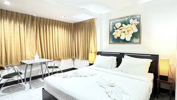 Room, 1 King Bed | Minibar, in-room safe, iron/ironing board, free WiFi