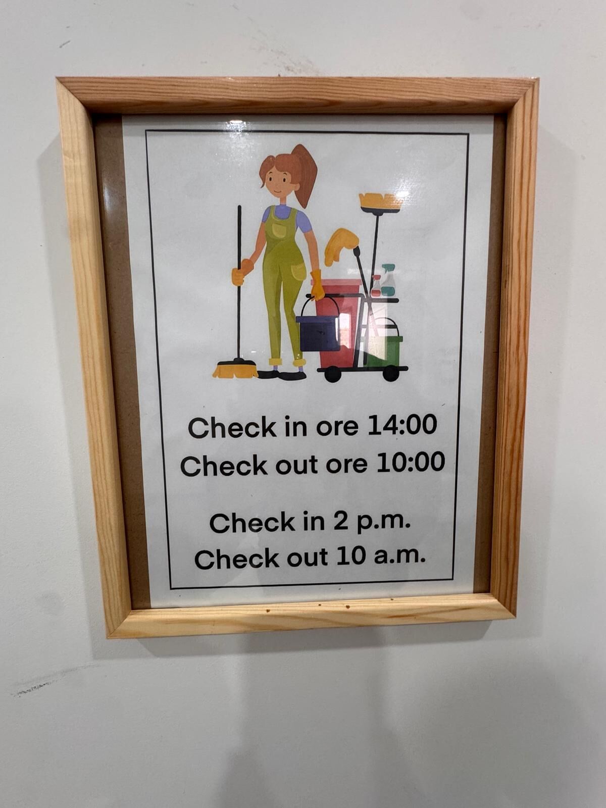 Un cartel enmarcado con instrucciones de limpieza y un personaje de dibujos animados.