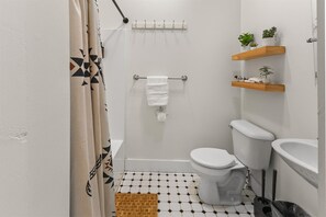 Shower, hair dryer, towels, shampoo