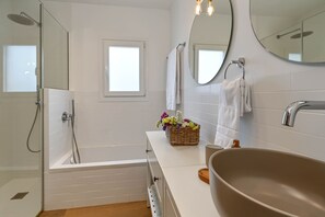 Shower, hair dryer, towels, toilet paper