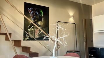 Executive Suite, Balcony, City View | Living area | TV