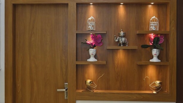 A wooden door with a built-in shelf unit above it. - Family Ties Homestay (Varanasi)