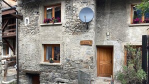 A stone building with a wooden door, a satellite dish, and a sign reading "Chalet Brieux". - Loft Bonziers - authentic alpine experience (6p, sauna) (Peisey-Nancroix)