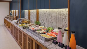 A buffet with various food items and drinks, including a sign for 'Healthy Diet Hot'. - Regenta Place Ahmedabad (Ahmedabad)
