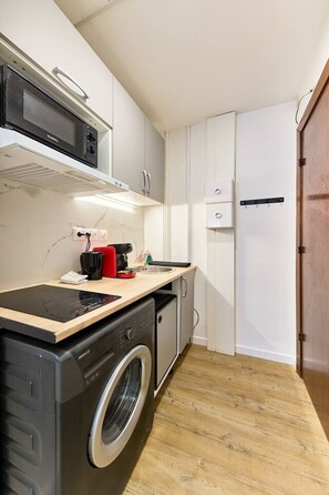Fridge, microwave, coffee/tea maker, cookware/dishes/utensils