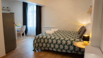 1 bedroom, desk, iron/ironing board, travel crib