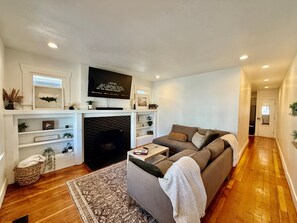 Smart TV, fireplace, books