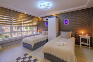 Family Condo, 3 Bedrooms, Air conditioning, City View | Premium bedding, desk, laptop workspace, iron/ironing board