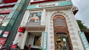 A hotel with a prominent sign for 'Hotel YSM Grand' and a jewelry store named 'PC Jeweller' on the ground floor. - YSM Grand  (Guwahati)