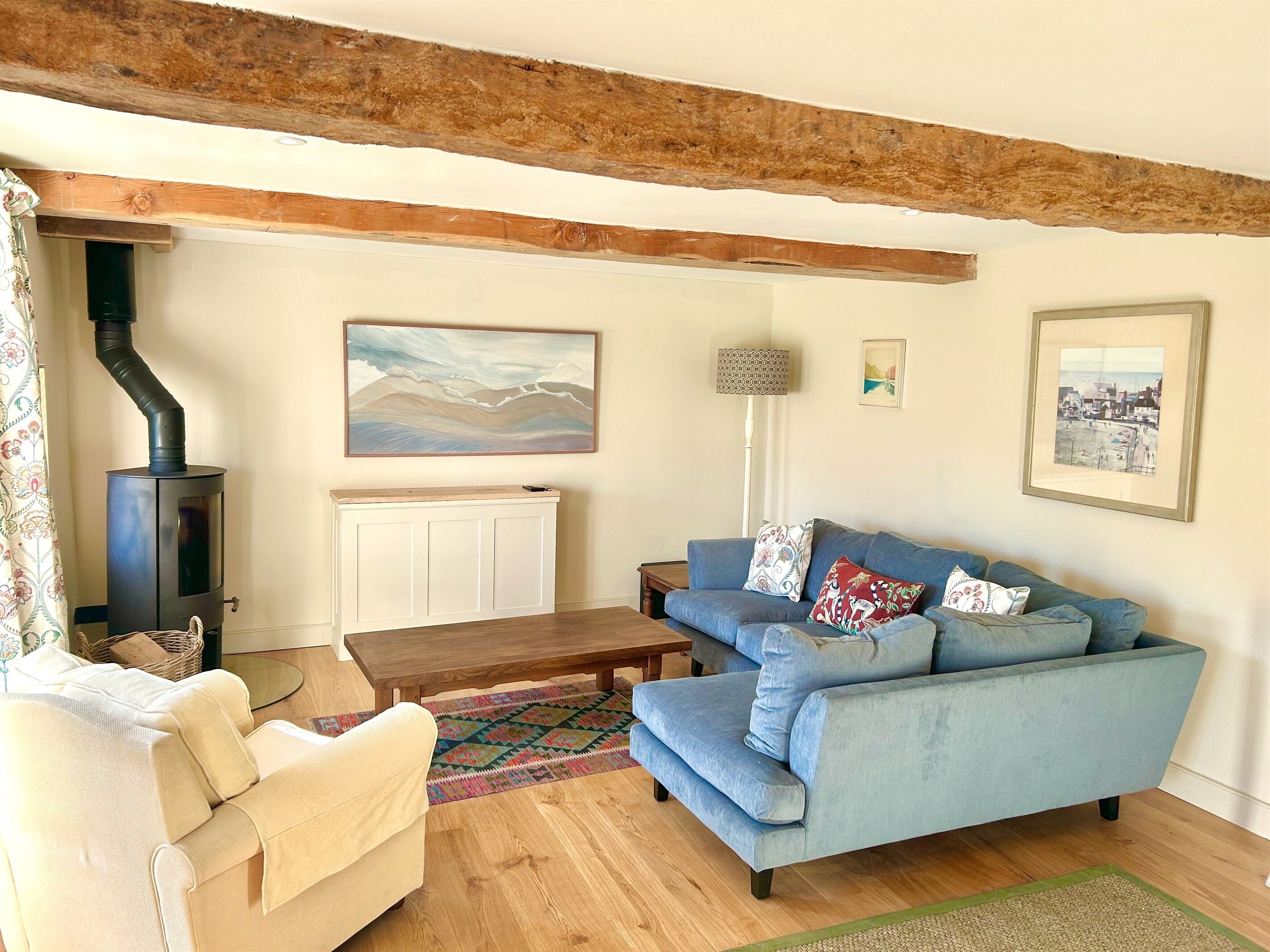 The living room with log burner (logs included) and pop-up TV