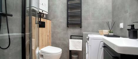 Shower, hair dryer, towels, shampoo