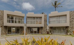 A modern building with large windows and stone walls. - House With Pool at Praia do Marceneiro Nluh0008 (Passo de Camaragibe)