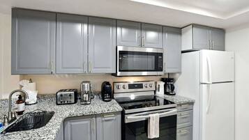 Coffee/tea maker, fridge, microwave, oven