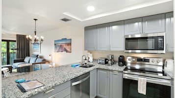 Coffee/tea maker, fridge, microwave, oven