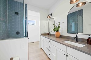 Shower, hair dryer, towels, shampoo