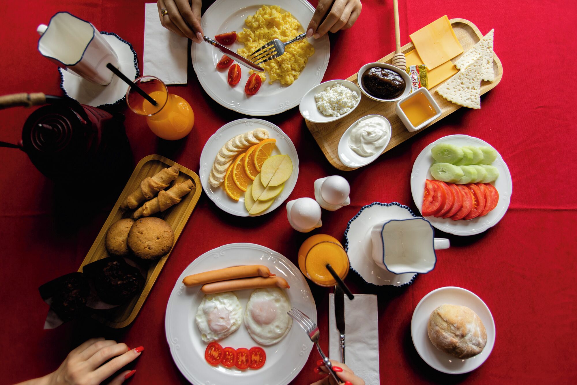 A table with various food items including eggs, cheese, and vegetables.
