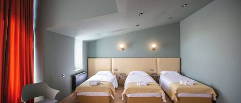 Standard Triple Room, 3 Single Beds | In-room safe, desk, laptop workspace, iron/ironing board