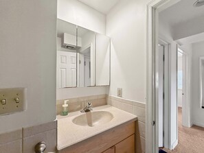 Shower, hair dryer, towels, shampoo