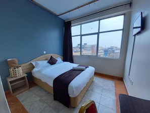 Habitación individual Deluxe | Wifi gratis y ropa de cama