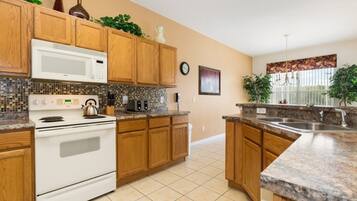 Villa, 4 Bedrooms | Private kitchen | Oven, coffee/tea maker, toaster