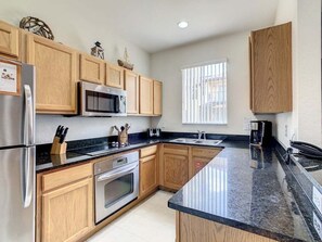 Townhome, 4 Bedrooms | Private kitchen | Fridge, oven, coffee/tea maker, toaster