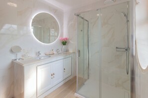Shower, hair dryer, towels, soap